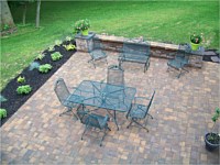 Patio With Sitting Wall and Flowerbed