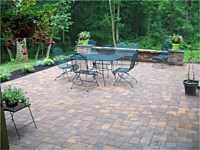 Patio With Sitting Wall and Flowerbed